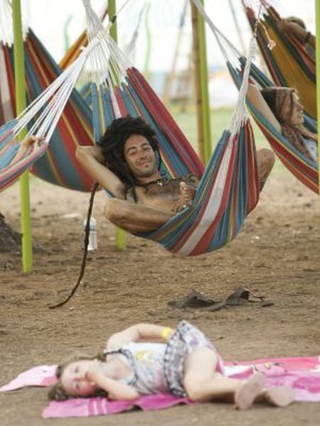 A festivalgoer at this year’s Rototom festival relaxes on a hammock.