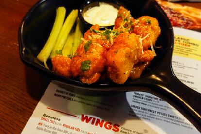 An order of "boneless chicken wings" is shown at a restaurant in Willow Grove, Pa., Wednesday, Feb. 8, 2023. With the Super Bowl at hand, behold the cheerful untruth that has been perpetrated upon (and generally with the blessing of) the chicken-consuming citizens of the United States on menus across the land: a “boneless wing” that isn’t a wing at all. (AP Photo/Matt Rourke)