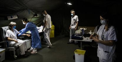 A field hospital in the Spanish region of Asturias tests health workers for coronavirus.