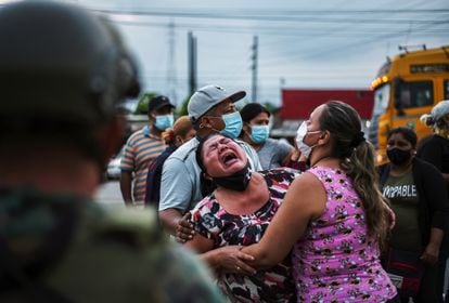 The relative of a prisoner cries outside a prison in Guayaquil, after disturbances inside the prison, in February 2021.