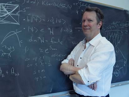 Sean M. Carroll poses in his office at Johns Hopkins University in Baltimore, in May 2023.