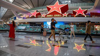 Travelers at Beijing-Daxing International Airport on August 31.