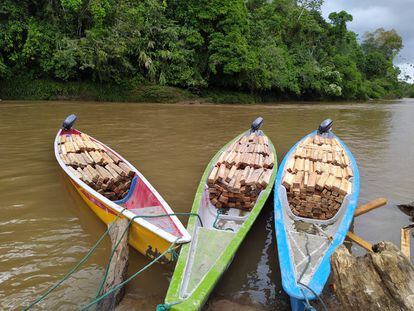Canoes filled with balsa wood on the Pastaza River, ready for unloading at Copataza, in Ecuador's Amazon region.