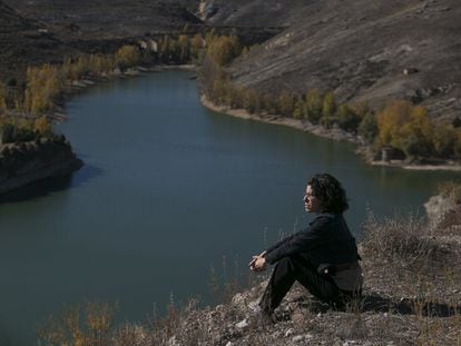 Author Montserrat Iglesias looks out over Linares reservoir.