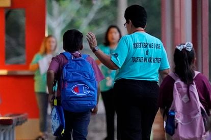 After more than a month's delay to implement improved security measures, students in Uvalde returned to class on September 6th. Pictured above, students enter a Uvalde elementary school accompanied by a teacher.