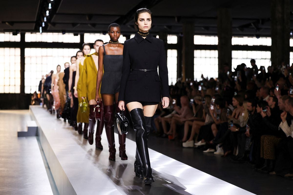 A catwalk at Milan Fashion Week has featured models with three