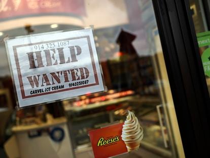 A help-wanted sign is posted in a storefront, Nov. 1, 2022, in Bedford, N.Y.
