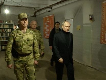 Russian President Vladimir Putin visits the national guard headquarters in the Luhansk Region, Russian-controlled Ukraine, in this still image taken from handout video released on April 18, 2023.