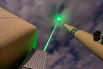 Illustration of a laser lightning rod in operation.