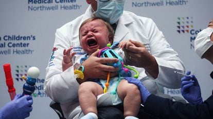 Oliver Harris, a nine-month baby is vaccinated against Covid-19 in New York.