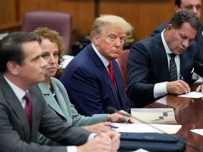 Former President Donald Trump sits at the defense table with his legal team in a Manhattan court, April 4, 2023, in New York.