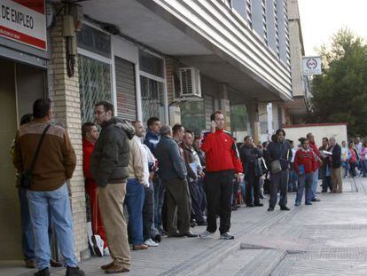 Unemployed workers line up to lodge jobless claims at a Spanish employment office.