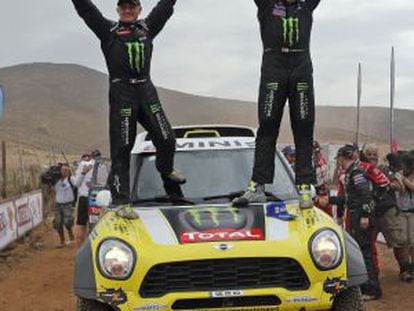 Nani Roma (r) and copilot Michel Perin celebrate their Dakar 2014 victory.