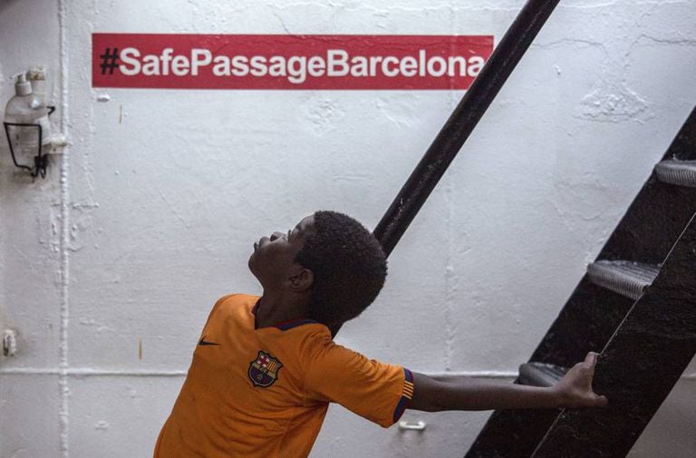 Khingsley Dokowada, nine, explores the Open Arms aid boat.