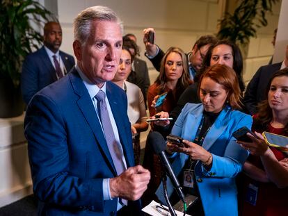 Speaker of the House Kevin McCarthy (L) responds to a question from the news media following a morning conference meeting in the US Capitol in Washington, DC, USA, 19 September 2023.