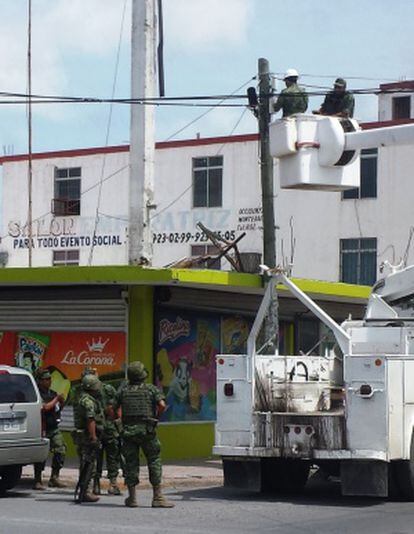 Authorities take down a hidden surveillance camera in Reynosa.