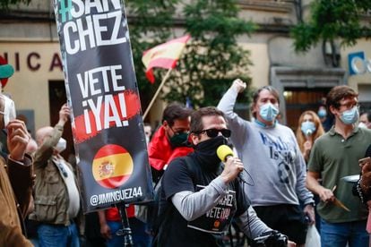 A sign reading “Get out Sánchez” is seen at a protest outside the Spanish Socialist Party headquarters in Madrid on Sunday.
