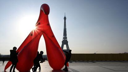 Members of the group 'Gang du clito' drag an inflatable clitoris in Paris on March 8, 2021.