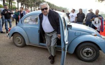 Outgoing president José Mújica emerges from his trademark Beetle.