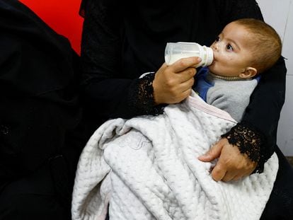 A baby is bottle-fed in a hospital in Rafah, southern Gaza, in late January.