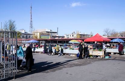 Dozens of people shop in the central market of Severodonetsk, on October 31, 2023. 

