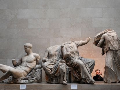 A visitor at the British Museum in front of part of the Parthenon Sculptures on January 9 in London.