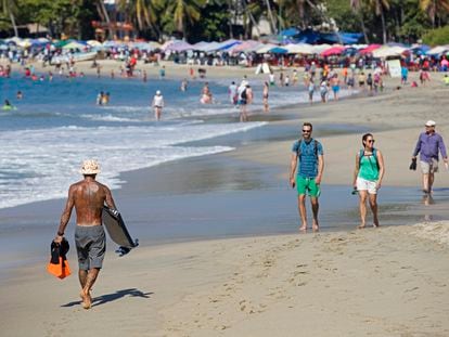 Tourists on a beach in Puerto Escondido in the Mexican state of Oaxaca.