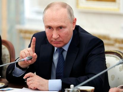 Russian President Vladimir Putin gestures as he speaks during a meeting with Russian war correspondents who cover a special military operation at the Kremlin in Moscow, Russia, Tuesday, June 13, 2023.
