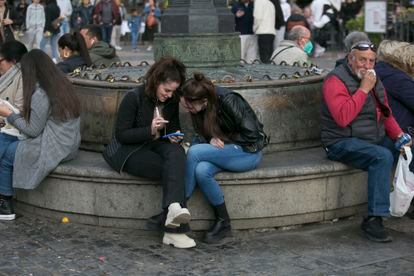 Two girls in Madrid’s Plaza Mayor in April, 2022. 