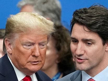 U.S. President Donald Trump talks with Canada's Prime Minister Justin Trudeau at the NATO summit in Watford, Britain, December 4, 2019.
