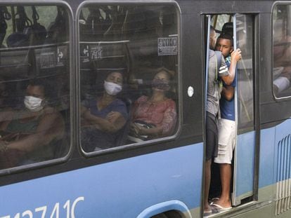 Passengers ride a public bus in Rio de Janeiro, Brazil.