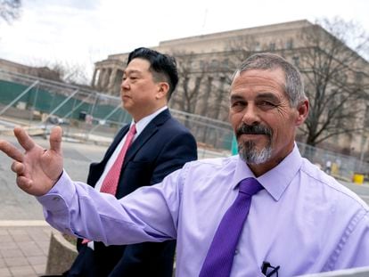 Kevin Seefried, right, a Delaware man who stormed the Capitol with Confederate battle flag, departs Federal Court after sentencing, Thursday, Feb. 9, 2023, in Washington, with his public defender Eugene Ohm.