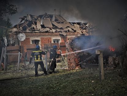 Firefighters put out flames in a bombed-out house in Orikhiv, Zaporizhzhia, June 21.