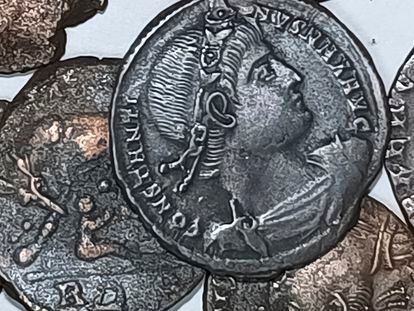 A picture made available by the Italian Culture Minister showing some of the discovered ancient bronze coins.