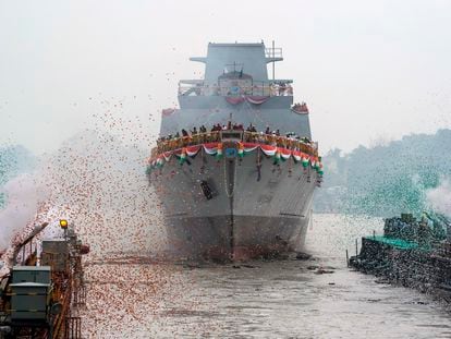 Confetti and smoke in the colors of the Indian national flag mark the entry of INS Vindhyagiri, a new warship for the Indian navy, in Kolkata, India, Aug. 17, 2023.
