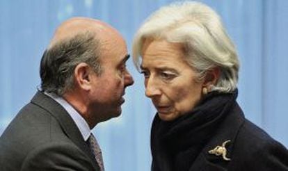 Spanish Economy Minister Luis de Guindos with IMF chief Christine Lagarde.