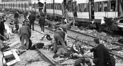 The first rescue workers rush to help victims of the Madrid train bombings.