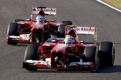 Felipe Massa (front) and Fernando Alonso joust during the Japanese Grand Prix.  