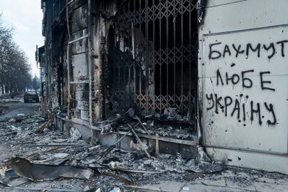 The city center damaged by Russian shelling in Bakhmut, Donetsk region, Ukraine, Friday, Feb. 10, 2023. Writing on the wall reads "Bakhmut loves Ukraine."