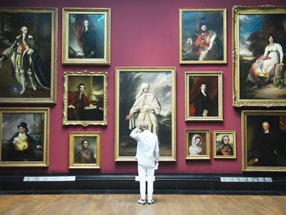 A visitor in front of the 'Portrait of Mai,' by painter Joshua Reynolds, in London’s National Portrait Gallery.