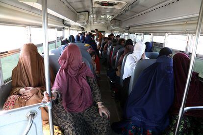 Afghan refugees in bus