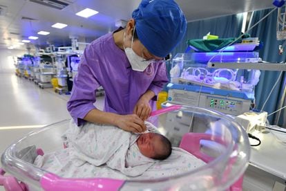 A nurse attends to a newborn at a hospital in Fuyang, China.