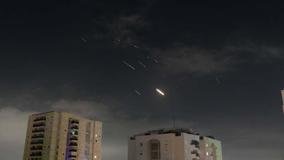 This photo taken on April 14, 2024 shows flares from explosions in the sky over Tel Aviv as Israel's anti-missile system intercepts missiles and drones from Iran.