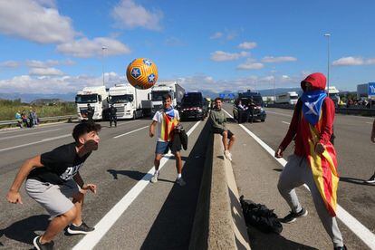 An impromptu soccer game on the C-25 road near Gurb, Catalonia.