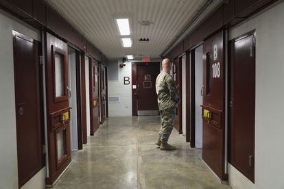 A U.S. soldier looks inside a cell at the ‘Gitmo’ maximum security detention facility at the U.S. Naval Station Guantánamo Bay, Cuba in 2016.