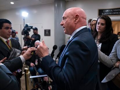 Senator Mark Kelly speaks with reporters following a classified briefing on China, at the Capitol in Washington on February 15, 2023.
