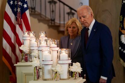 President Joe Biden, along with first lady Jill Biden, pauses at a memorial display before speaking on the one-year anniversary of the school shooting in Uvalde, Texas, at the White House, on May 24, 2023.