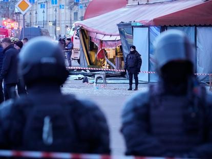 Russian police officers are seen at the site of an explosion at a cafe in St. Petersburg, Russia, on April 2, 2023.