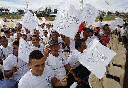 Members of the Revolutionary Armed Forces of Colombia (FARC) wave white peace flags during an act to commemorate the completion of the disarmament process.