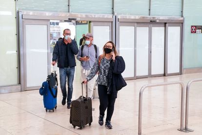 Passengers arrive this week in Madrid's Barajas Airport.